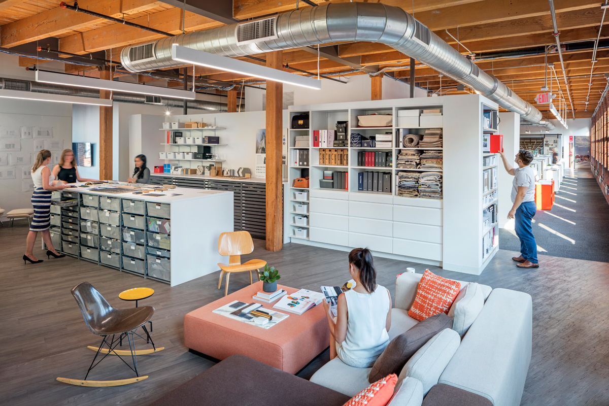 Hacin + Associates work space lounge with seating and a desk