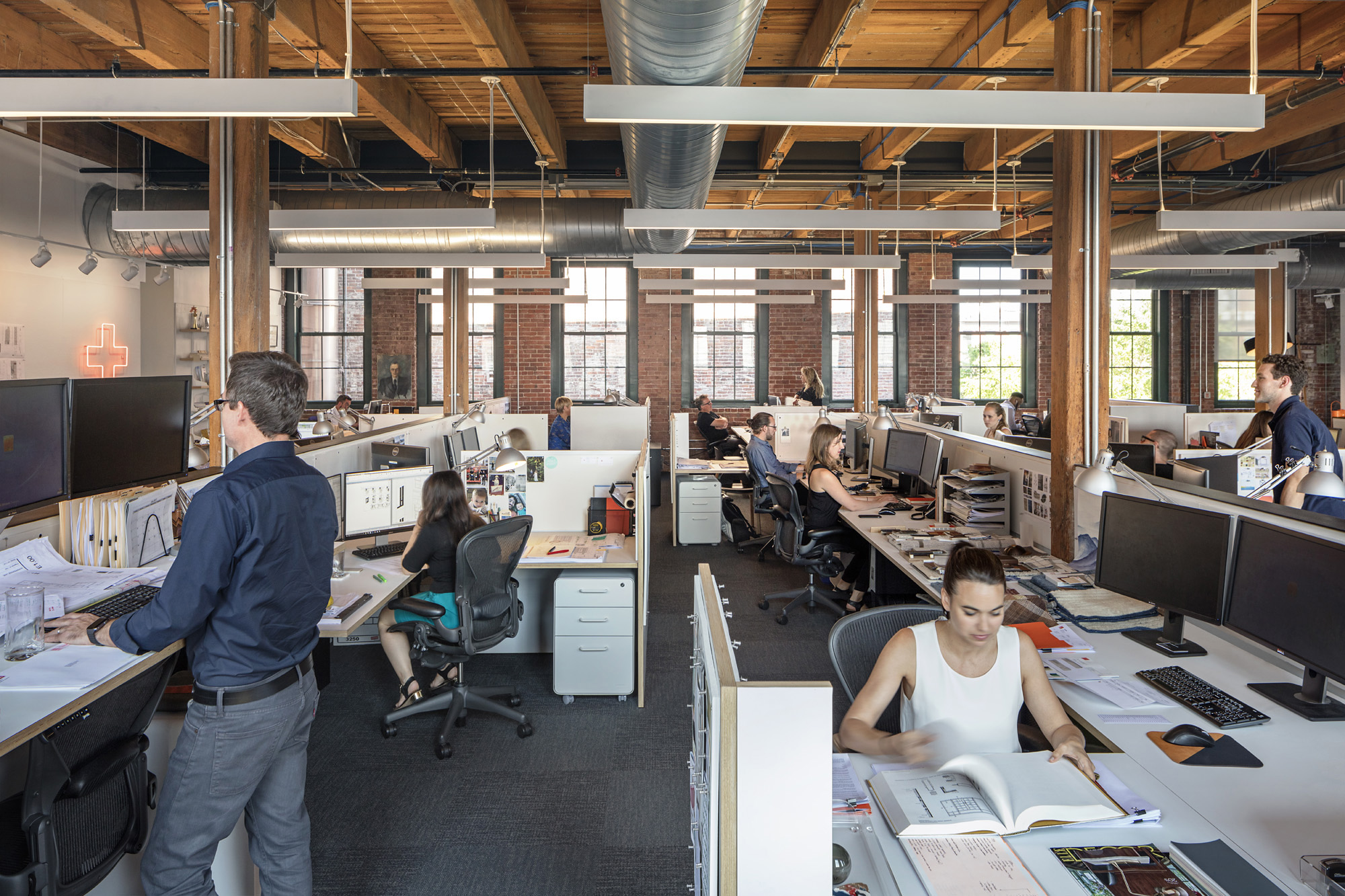 Hacin + Associates office space with employees at their desks