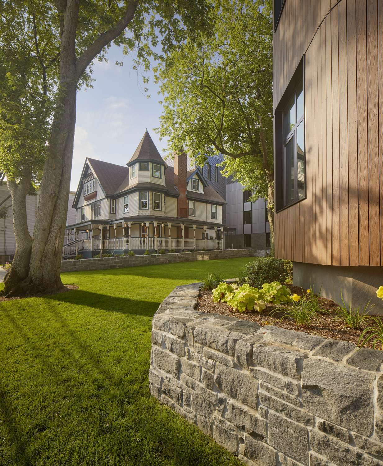 Stunning, sunny front yard of a historical multi-family home