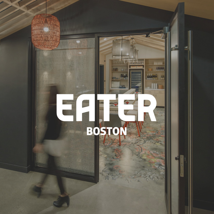 Eater Boston logo with modern hallway background