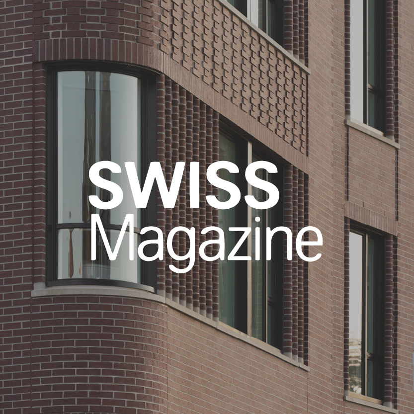 Swiss Magazine logo with brick building background