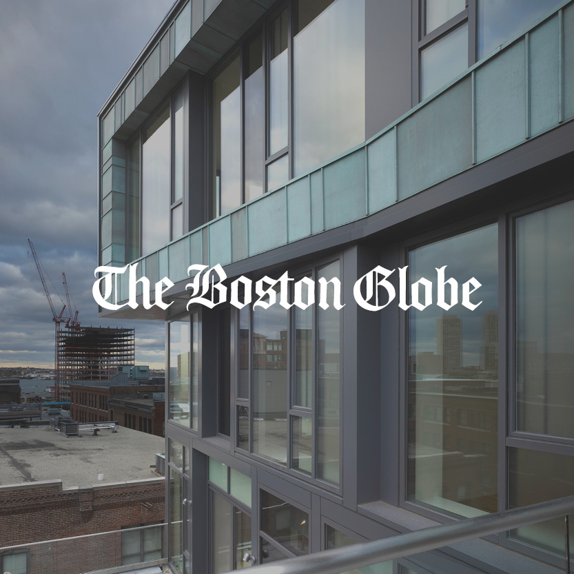 The Boston Globe logo with glass building background