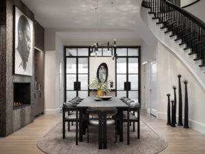 A sleek, neutral dining room with impressive art displayed